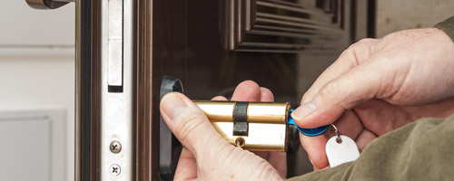 Rekeying a lock for a business in Queens, NY.